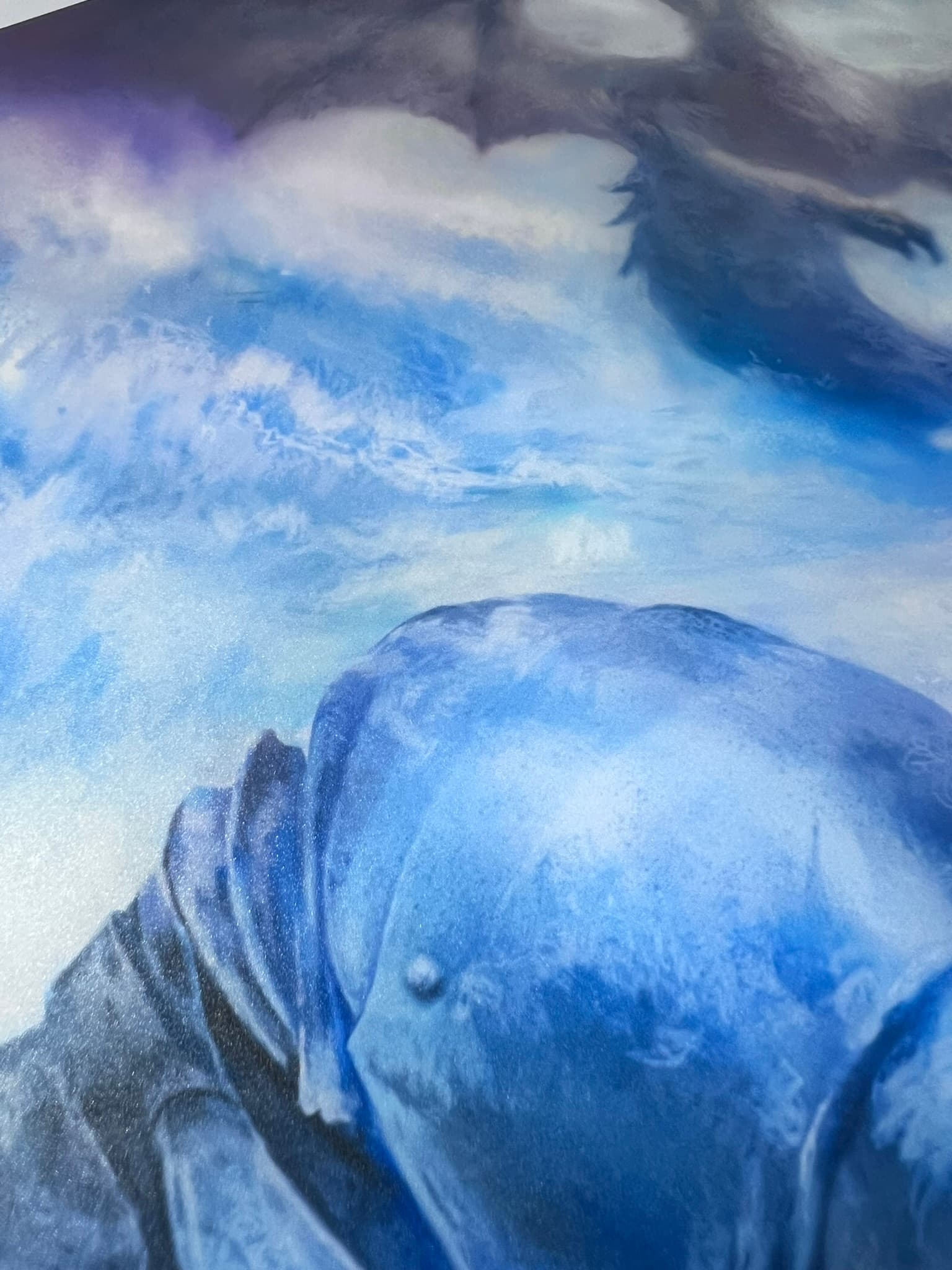 Detail of the Ryo's watercolor artwork featuring deep blues and silvers